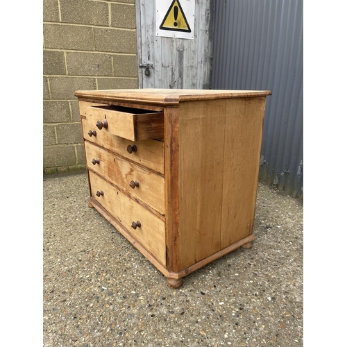 99 - A stripped pine chest of five drawers 118x64x99