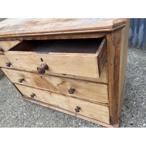 99 - A stripped pine chest of five drawers 118x64x99