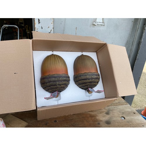 237 - A pair of new artificial giant acorn in box