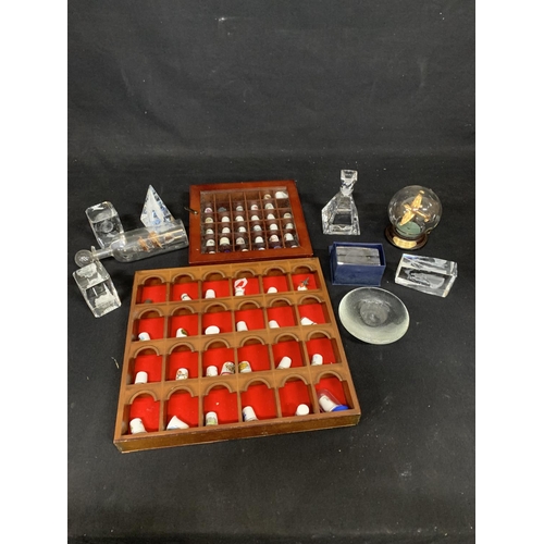 1021 - Two cases of thimbles and glass Paperweights