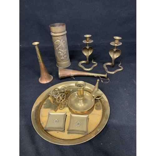 Brass trenchart shell, pair cobra candlesticks, small brassware and 2