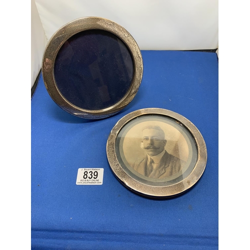 839 - Two Hallmarked Silver circular photo frames each approx. 15 cms one lacking stand