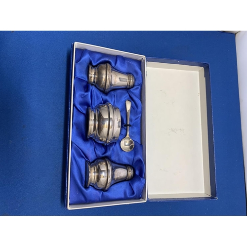 845 - Boxed Hallmarked Silver three piece cruet Set with blue glass liner, net weight 1.85 ozt