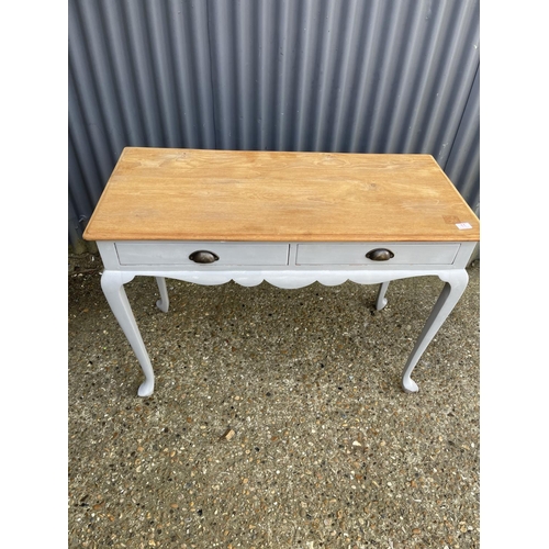 11 - A grey painted light oak two drawer writing table 108x48x 76