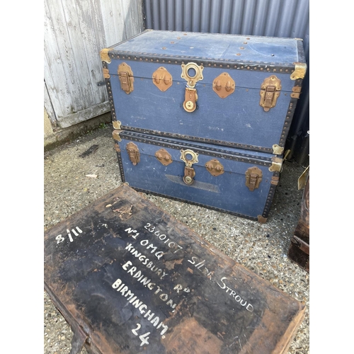 13 - A vintage military tin trunk together with five other vintage travelling trunks