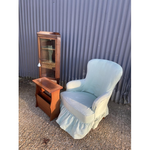 134 - A green bedroom chair, corner cabinet and a magazine table