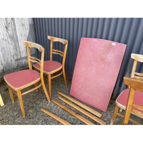 15 - A red formica kitchen table together with four chairs and a yellow painted side table