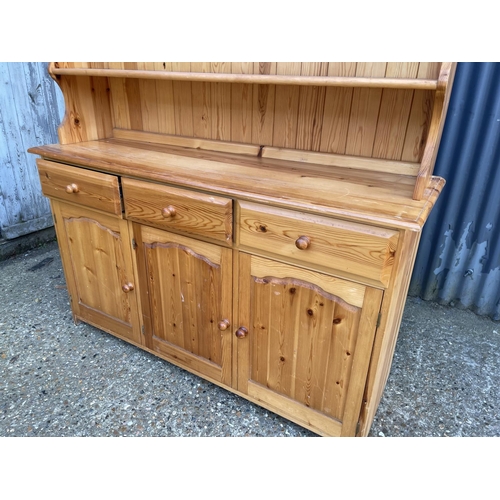 18 - A modern pine dresser with leaded glass top