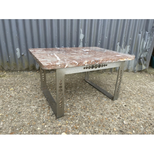A granite top coffee table with industrial steel base 71x50x40
