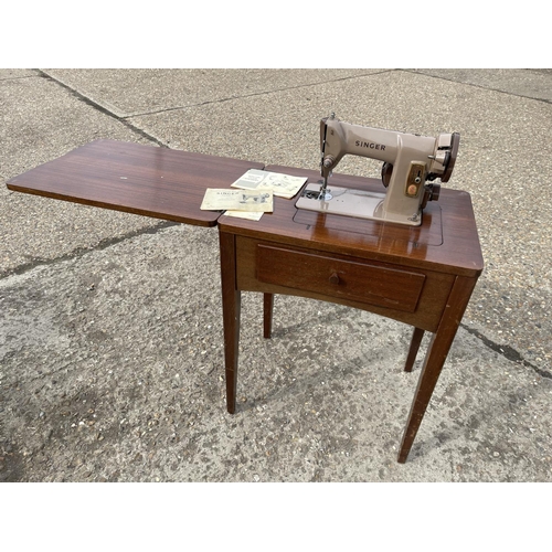 A singer sewing machine table