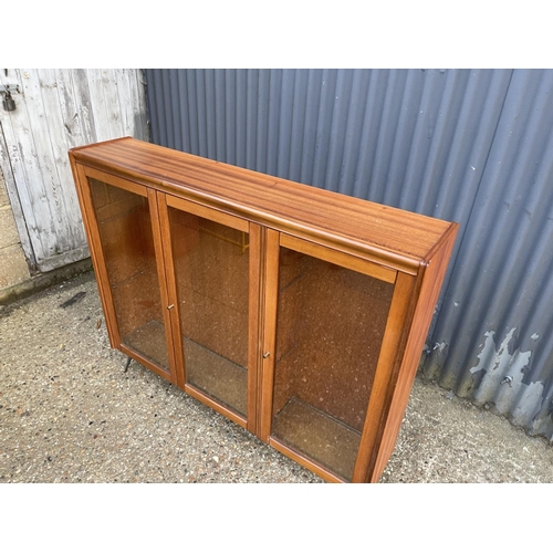 40 - Mid century glazed teak bookcase on hairpin legs height 106, width 127 depth 26 cms