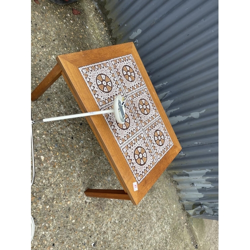 41 - A mid century teak tile top coffee table together with a modern light fitting