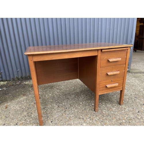 42 - A small mid century oak three drawer oak typists desk 108x60x75