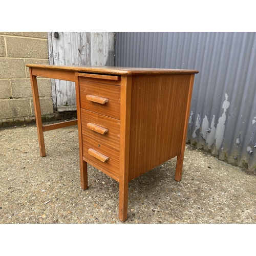 42 - A small mid century oak three drawer oak typists desk 108x60x75