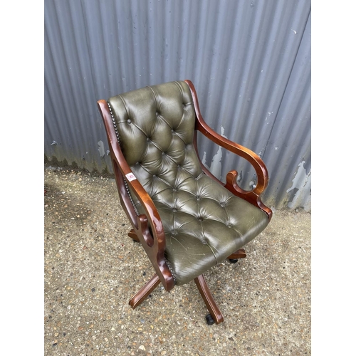 43 - A green leather chesterfield office chair