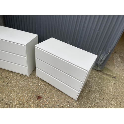 50 - A pair white painted chests of three