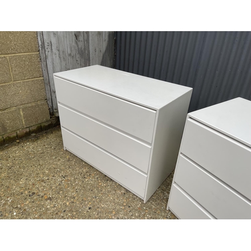 50 - A pair white painted chests of three