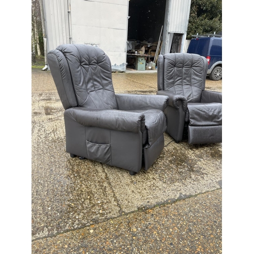 55 - A pair of brown leather electric recliner armchairs