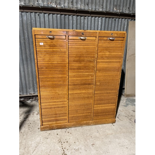 63 - A large three section tambour cabinet with one key 124x35x150