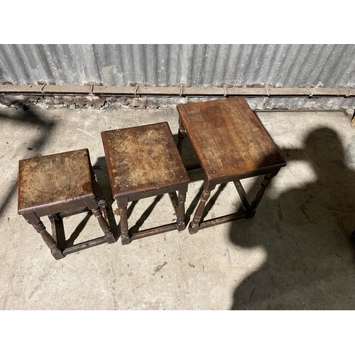 65 - An antique oak nest of three tables 36x45 x56