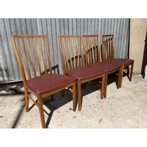 66 - A set of four mid century teak chairs