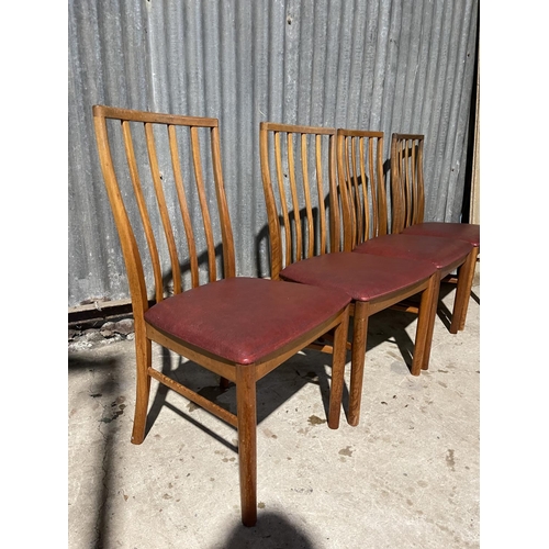 66 - A set of four mid century teak chairs