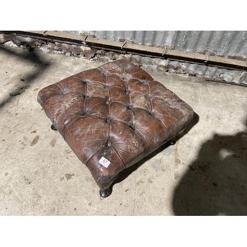 67 - A brown leather chesterfield footstool