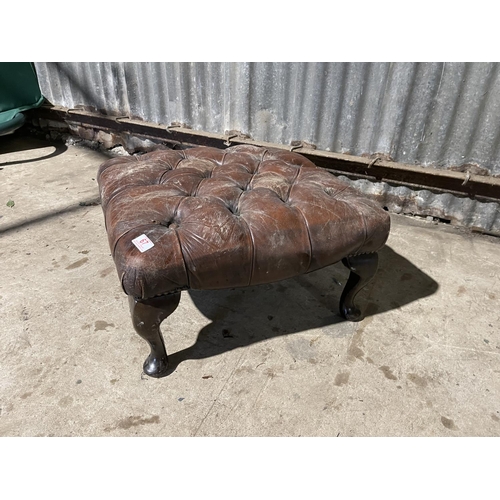 67 - A brown leather chesterfield footstool