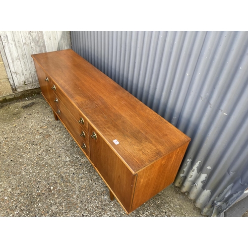 8 - A mid century teak sideboard with three drawers and two cupboard doors  184 x 46x77