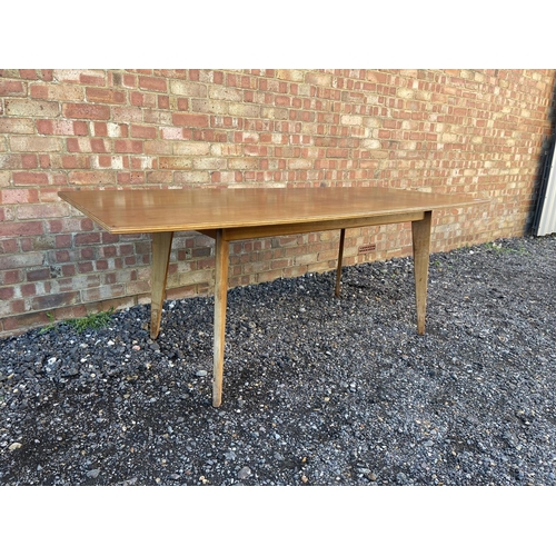 10 - A mid century teak plank top dining table possibly by Alfred Cox 199x94x74