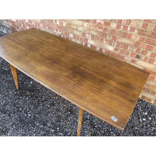 10 - A mid century teak plank top dining table possibly by Alfred Cox 199x94x74