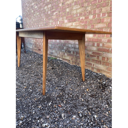 10 - A mid century teak plank top dining table possibly by Alfred Cox 199x94x74