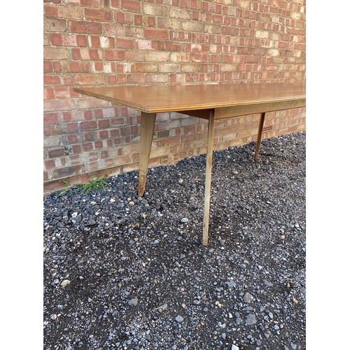 10 - A mid century teak plank top dining table possibly by Alfred Cox 199x94x74