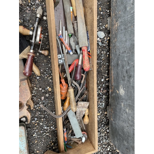 100 - An antique carpenters chest with assorted vintage tools inside