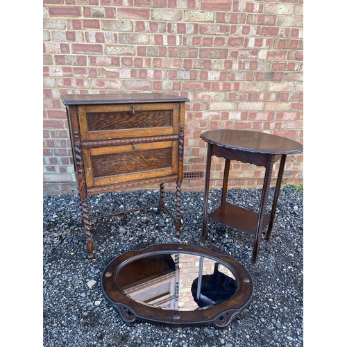 11 - An oak drinks / gramophone cabinet together with an oak mirror and a occasional table