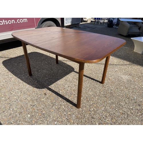 115 - A mid century g plan teak extending dining table