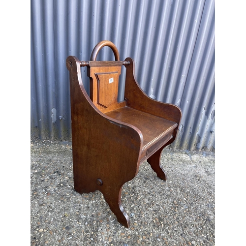 131 - An aesthetic movement mahogany hall seat