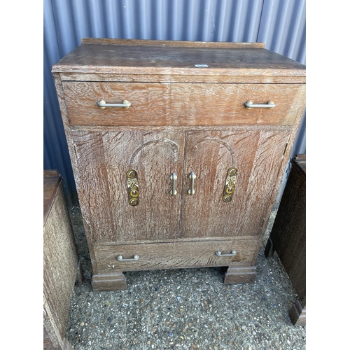 132 - A deco style limed oak tallboy together with pair of matching bedsides