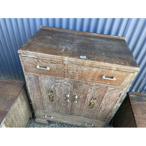 132 - A deco style limed oak tallboy together with pair of matching bedsides