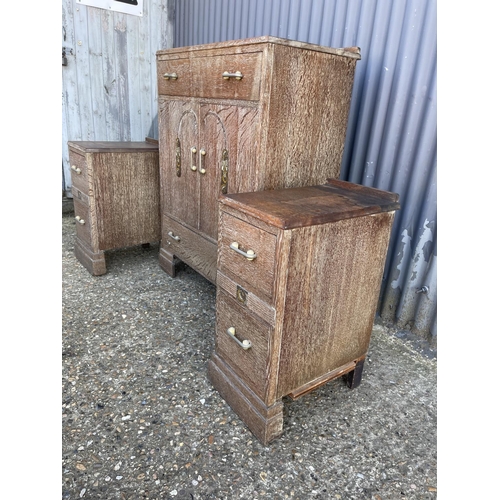 132 - A deco style limed oak tallboy together with pair of matching bedsides