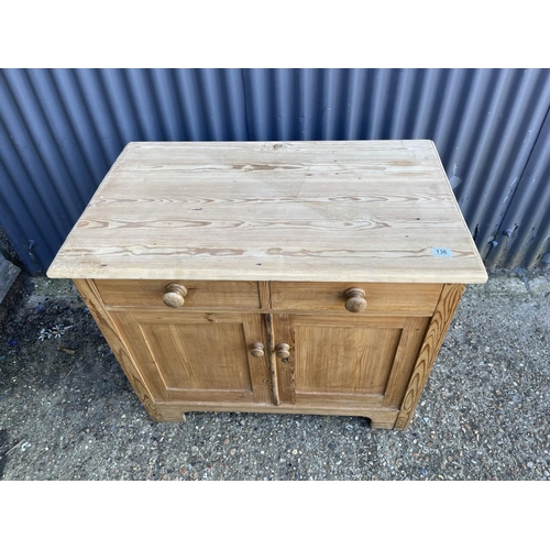 136 - A small country pine sideboard with two drawers over two doors 92x56x78