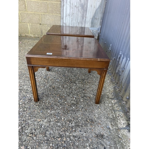 141 - A pair of reproduction mahogany lamp tables 62cm square