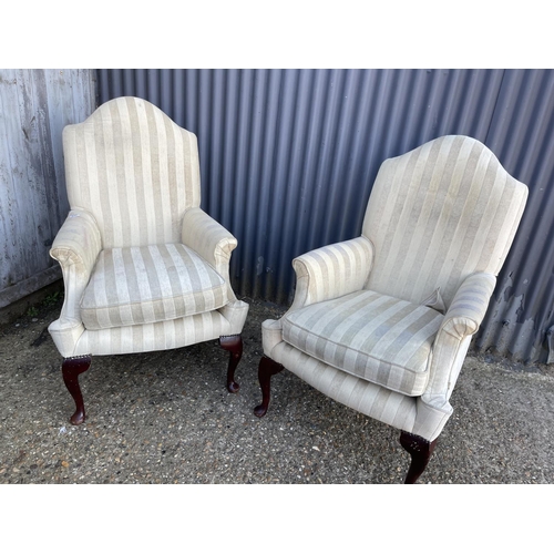 142 - A pair of beige striped armchairs