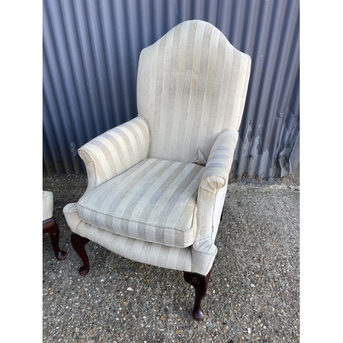 142 - A pair of beige striped armchairs