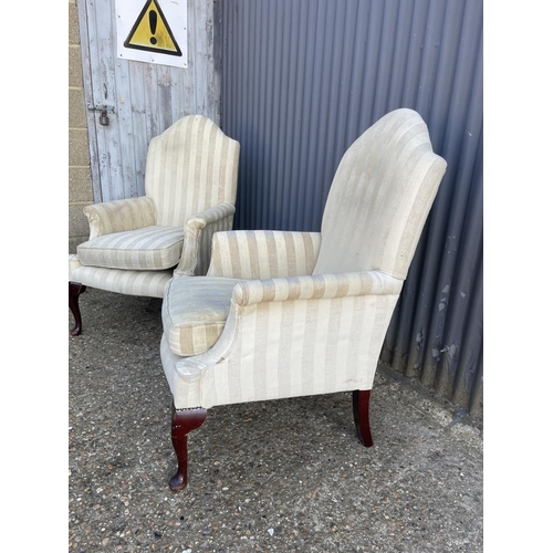 142 - A pair of beige striped armchairs