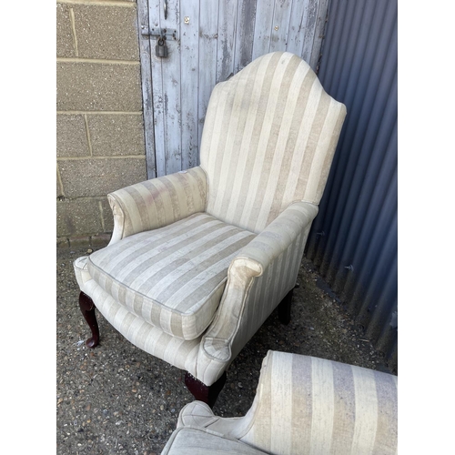 142 - A pair of beige striped armchairs