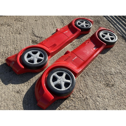 147 - A pair of red race car plastic wall plaques 200cm