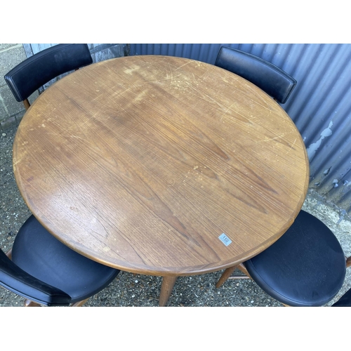 150 - A g plan fresco teak circular extending dining table together with four matching g plan dining chair... 