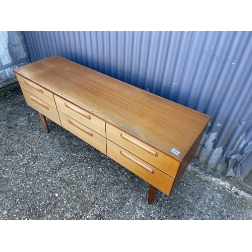 154 - A mid century teak chest of six drawers with optional mirror and haunches 150x44x70