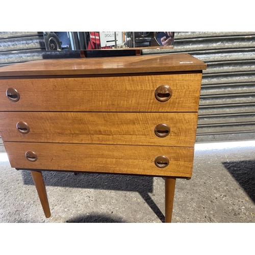 180d - A retro teak dressing chest of three